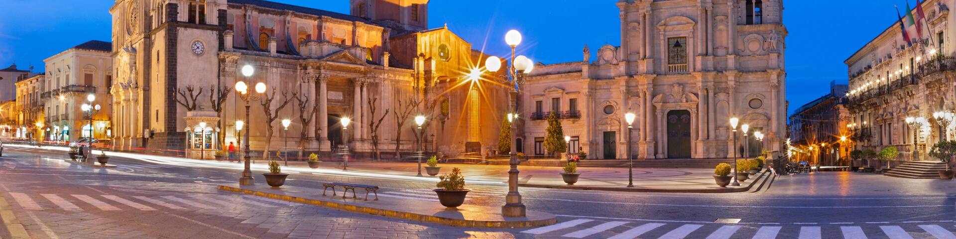 Acireale - The Duomo (Maria Santissima Annunziata) and the church Basilica dei Santi Pietro e Paolo at dusk.