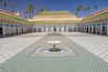 Courtyard at El Bahia Palace, Marrakech, Morocco. In the middle are small white fountains