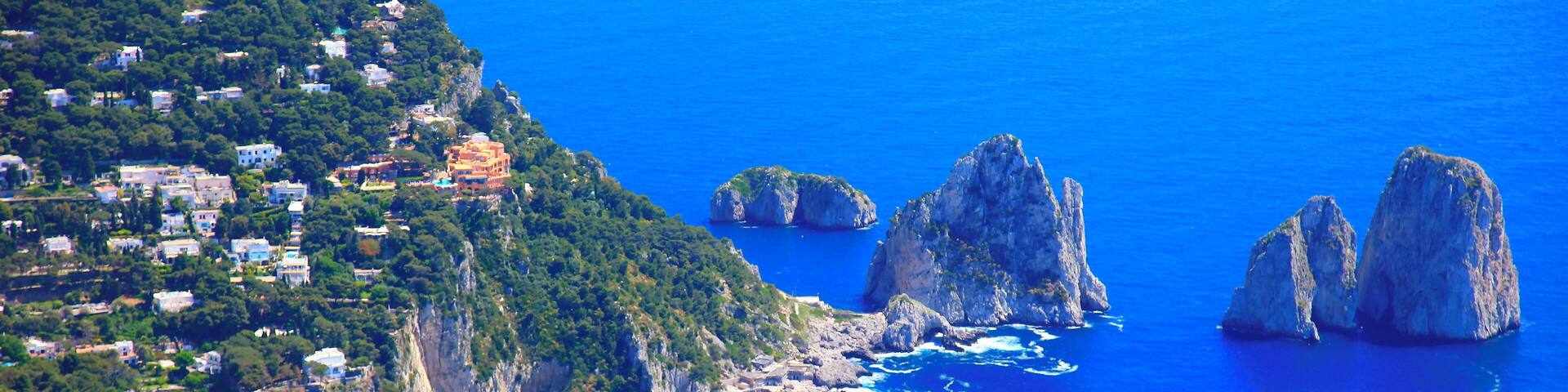 Capri island panorama from Monte Solaro, Faraglioni and Tyrrhenian sea, Bay of Naples, Italy.
