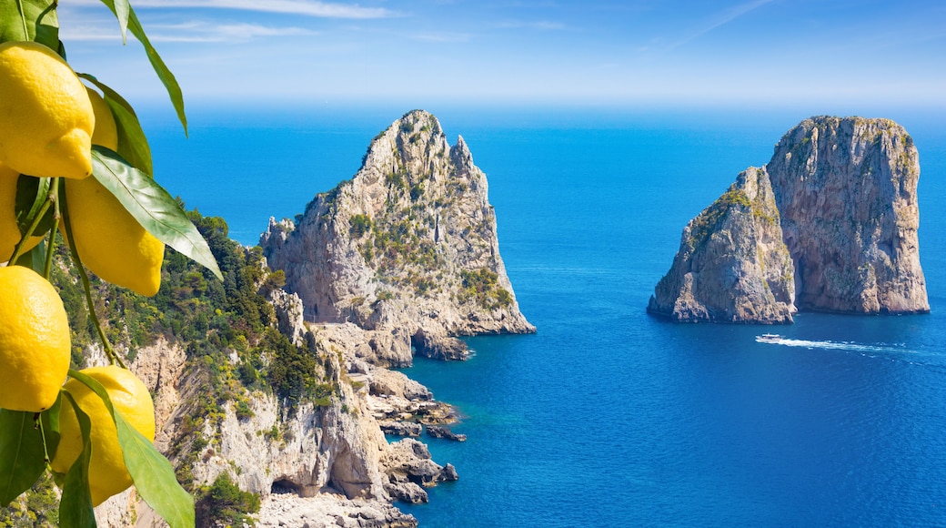 Daylight view of famous Faraglioni Rocks, Capri Island, Italy.