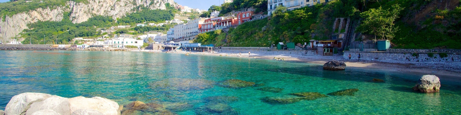 Capri showing a coastal town, rugged coastline and swimming