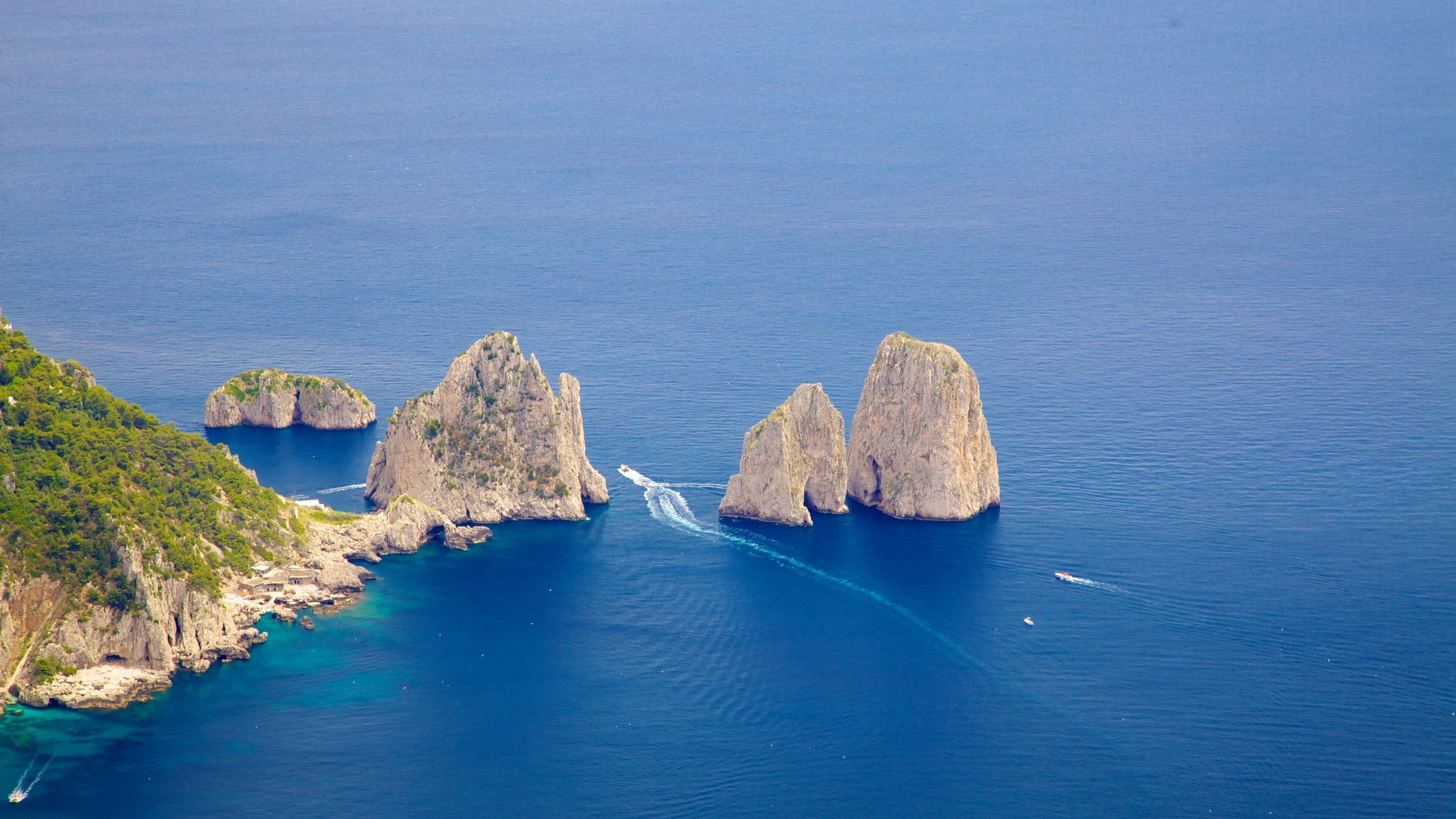 Mount Solaro featuring rugged coastline, a coastal town and landscape views