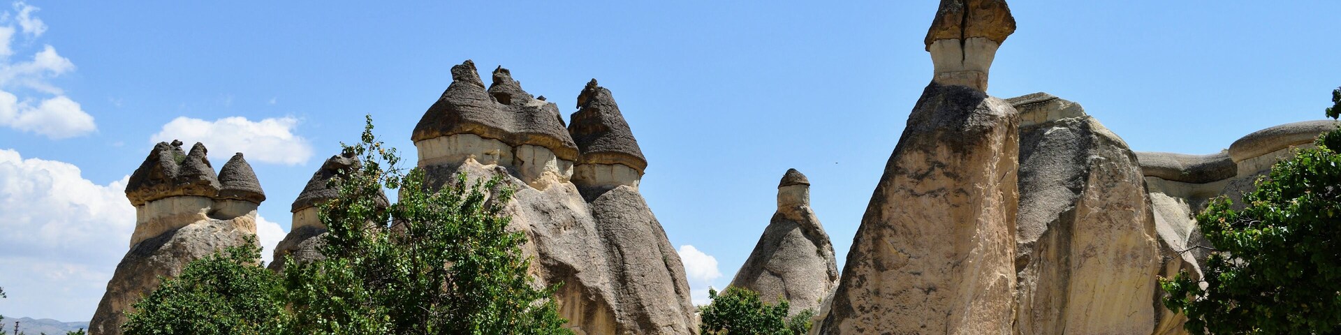 Pasabag or Monk's valley in the Cappadocia region is famous for its fairy chimneys, unique rock formations that look like they have a hat at the top. The erosion slowly leads to certain 'hats' falling off and it's always safe to be aware of the rock you're posing below!