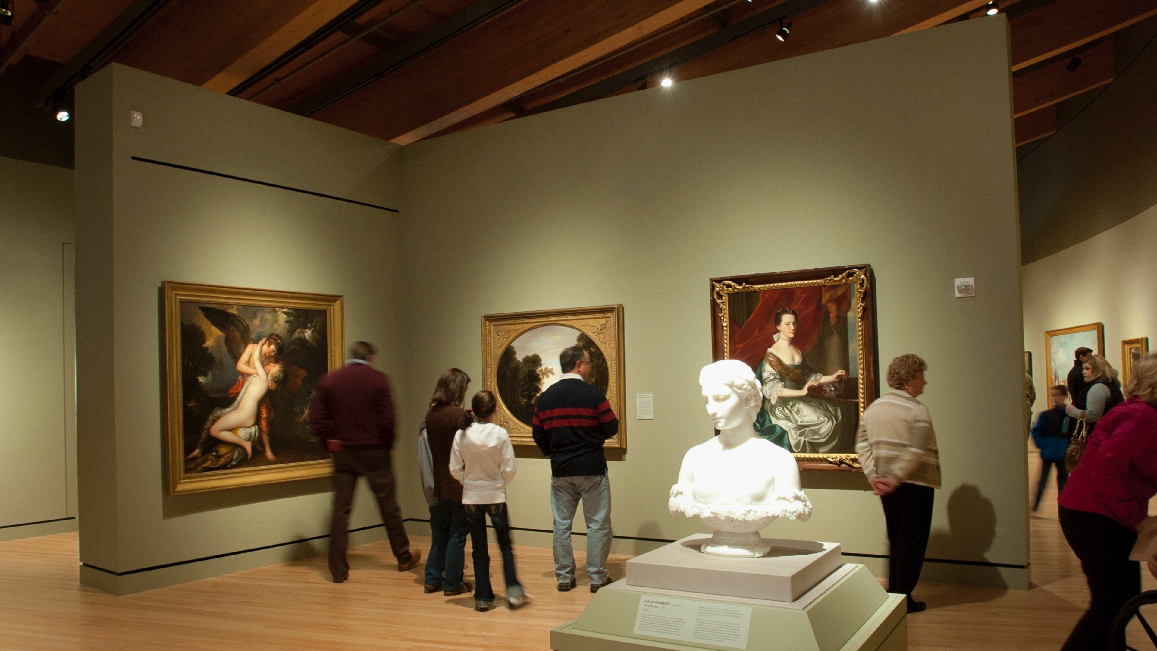 Crystal Bridges Museum of American Art featuring art and interior views as well as a small group of people