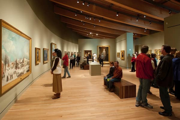 Crystal Bridges Museum of American Art which includes art and interior views as well as a small group of people