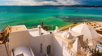 Hammamet, Tunisia. Image of architecture of old medina with dramatic sky at sunset time.