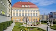 Wroclaw Palace featuring a statue or sculpture, a garden and heritage elements