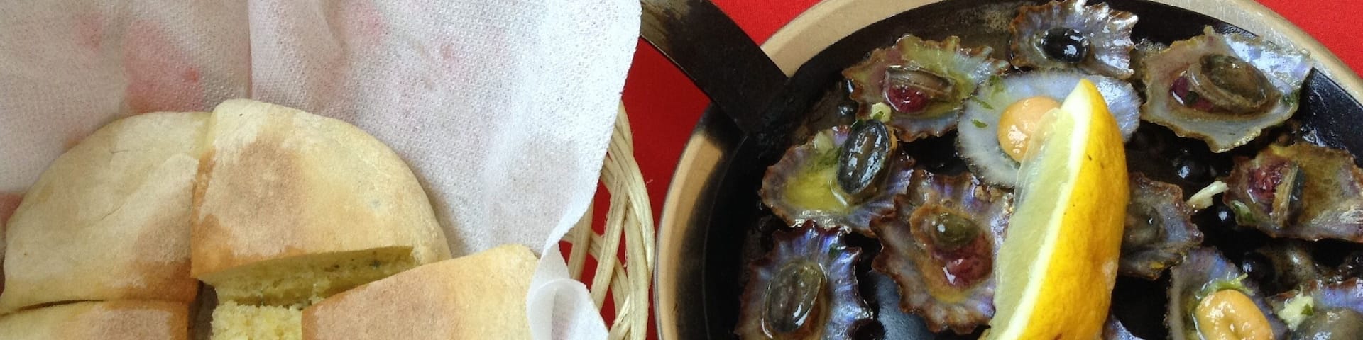 Two plates you can taste when you are visiting Madeira Island! “Lapas” and “bolo do caco” with garlic butter !!