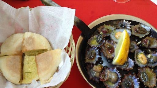 Two plates you can taste when you are visiting Madeira Island! “Lapas” and “bolo do caco” with garlic butter !!
