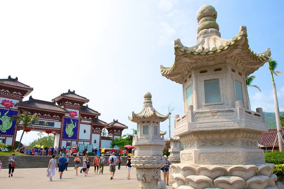 Traditional Chinese architecture with ornate pagodas and a bustling crowd.
