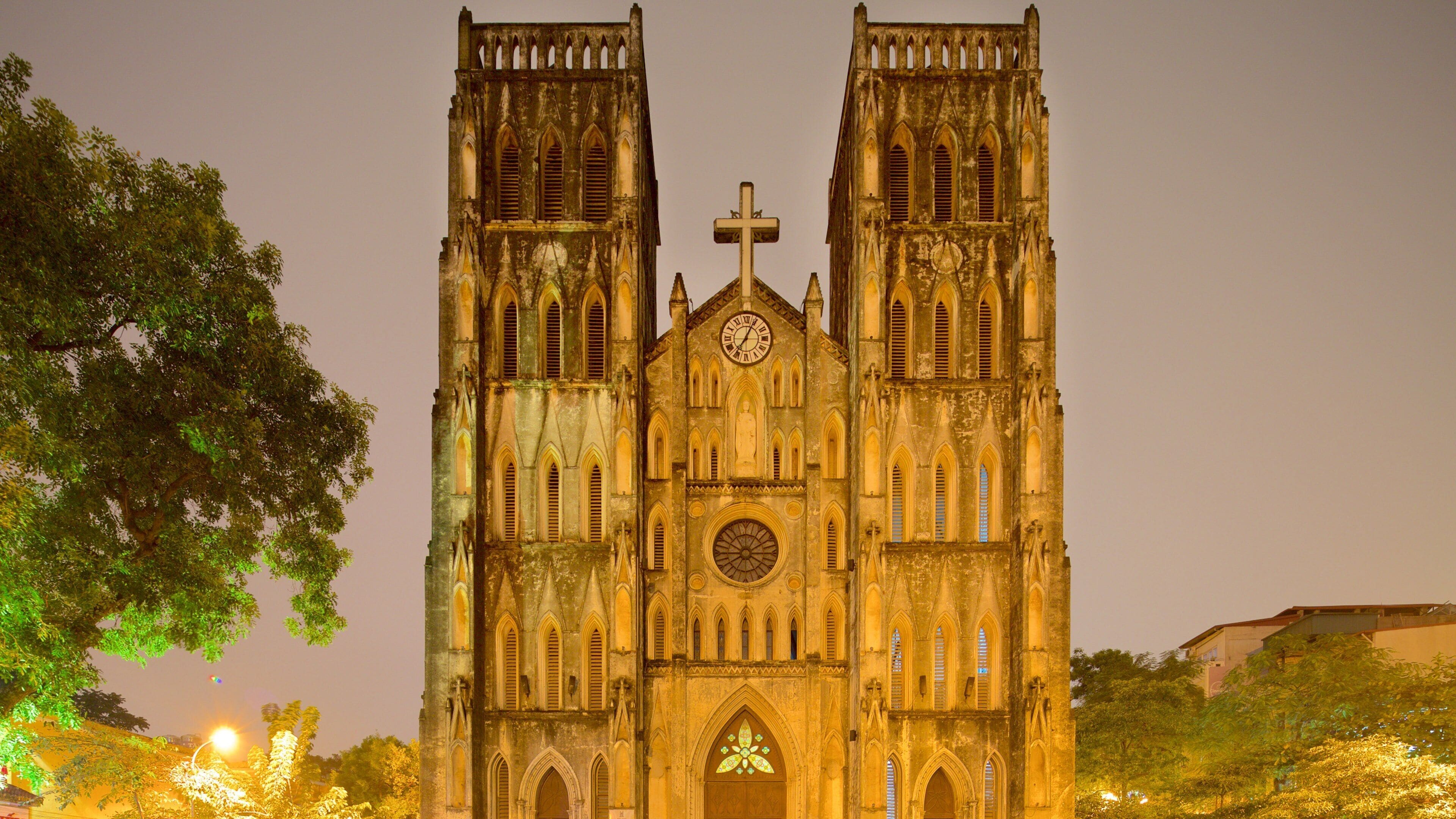 St. Joseph Cathedral featuring heritage architecture, markets and a church or cathedral