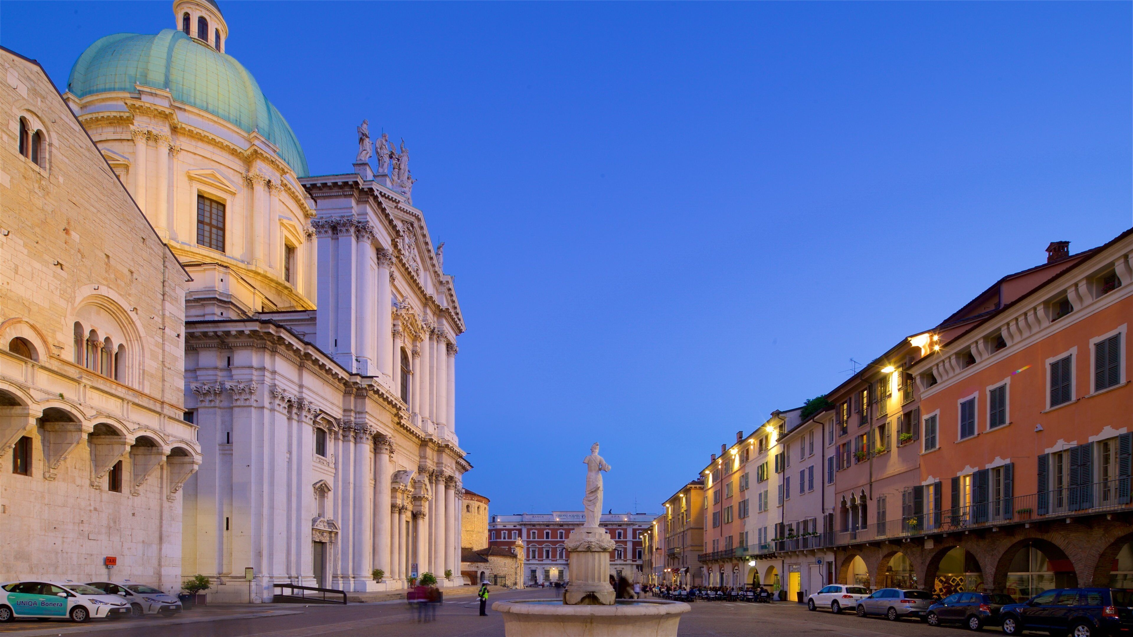 Piazza del Duomo featuring heritage architecture, a fountain and a square or plaza