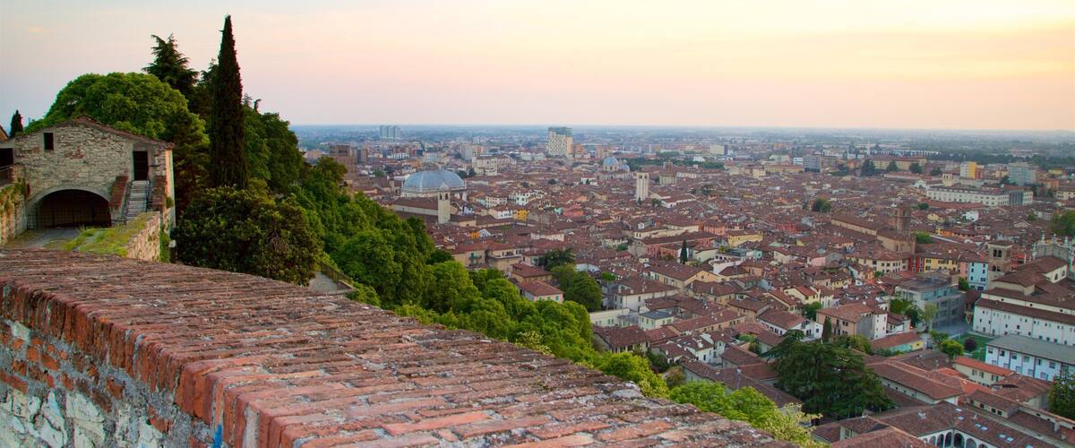 Brescia Castle which includes a sunset, landscape views and a city
