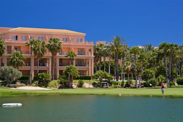 Alicante Golf Course showing a lake or waterhole and golf