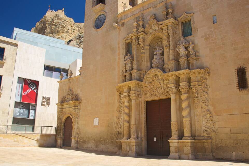 A historic building with ornate carvings and a large wooden door.