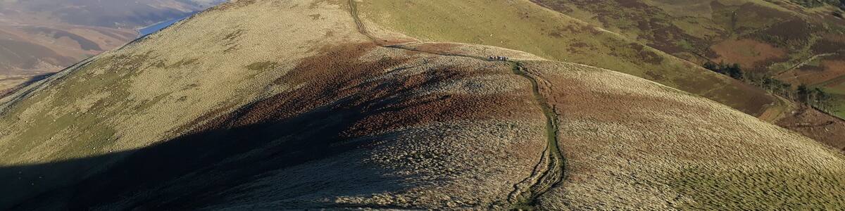 Descending West Kip in bright low sun