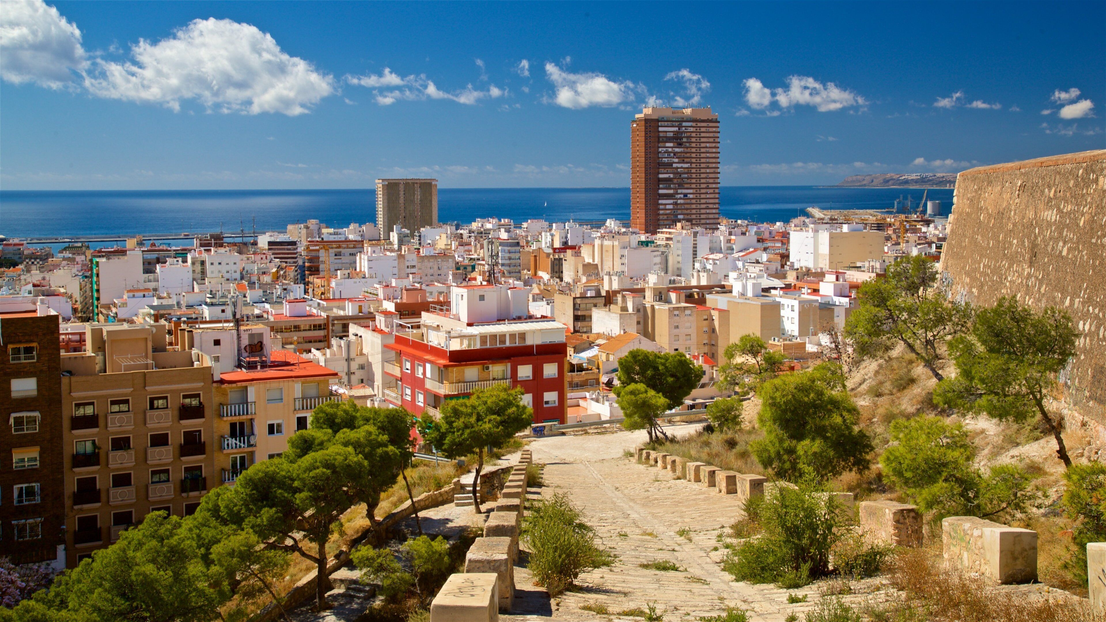 San Fernando Castle showing a coastal town and landscape views