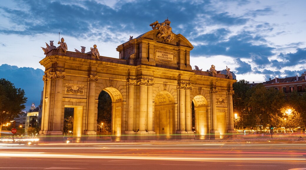 Puerta de Alcala featuring night scenes and heritage architecture