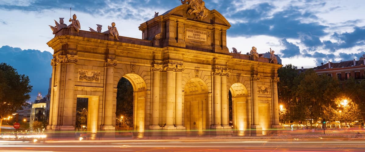 Puerta de Alcala featuring night scenes and heritage architecture