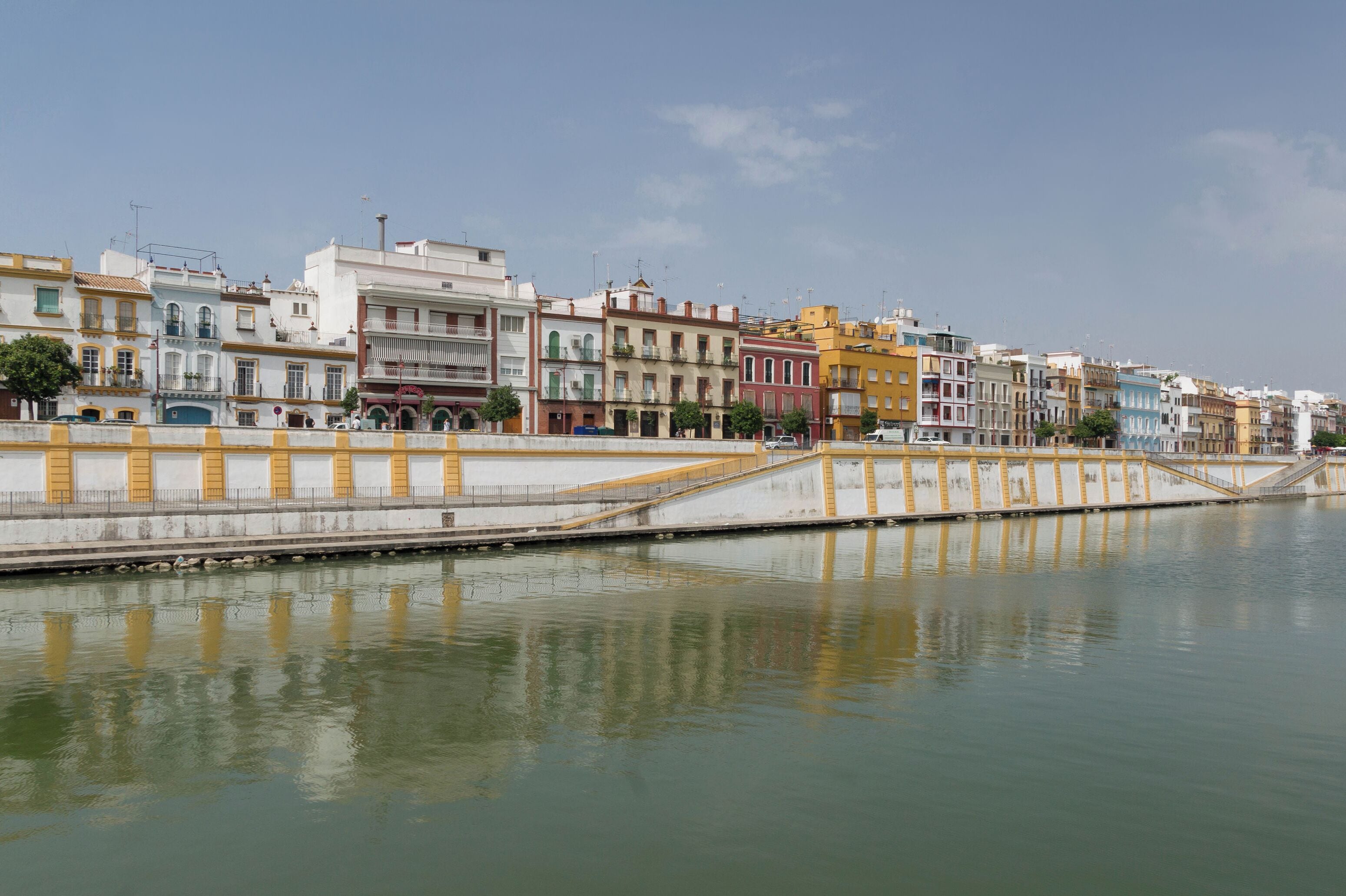 The embankment of the Triana neighborhood, as seen from a boat on the Guadalquivir river, Seville, Spain.