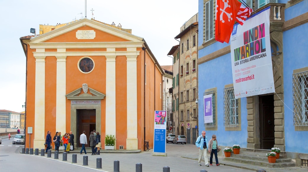 Palazzo Blu which includes street scenes, signage and a city