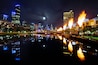 Moonrise over Melbourne city with the Corwn Casino fireballs are at display