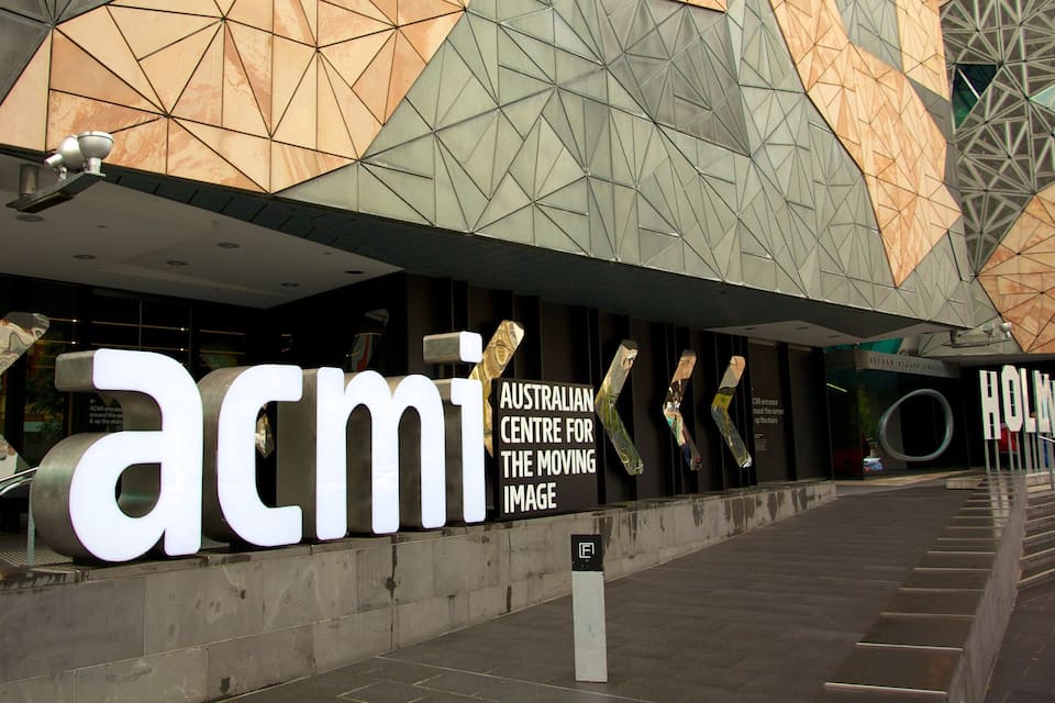 The exterior of the Australian Centre for the Moving Image with large illuminated signage.
