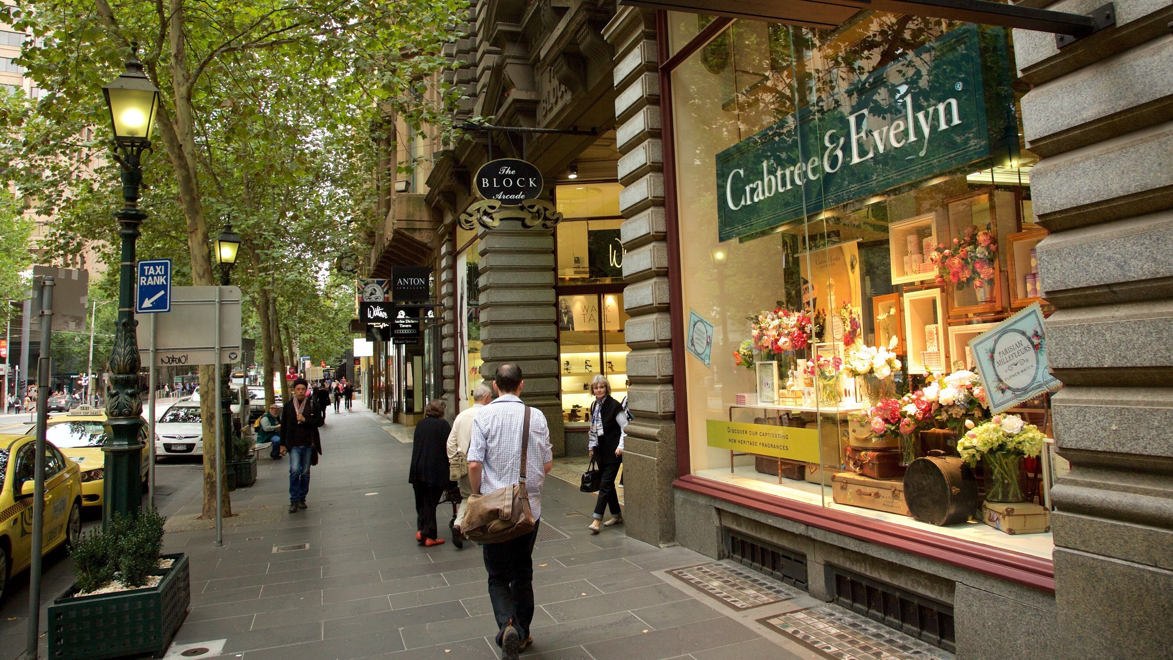 Block Arcade showing shopping as well as a small group of people