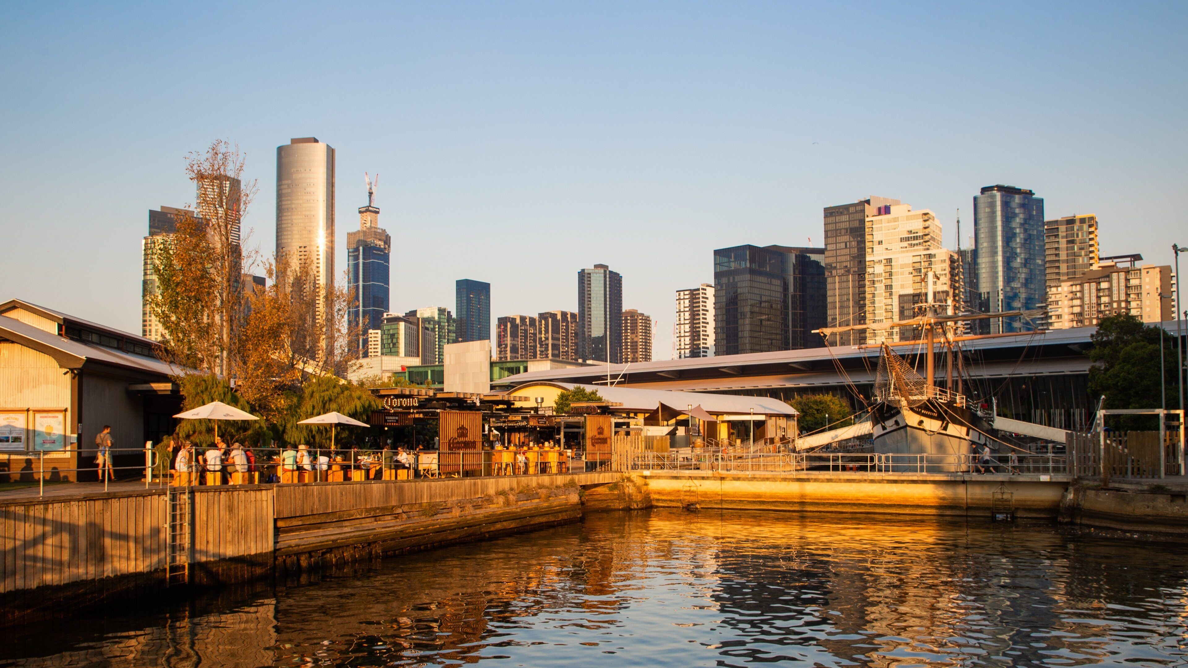 Southbank Promenade featuring a bay or harbor, a sunset and a city