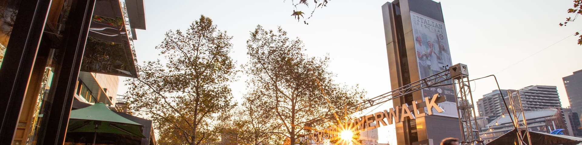 Southbank Promenade showing street scenes, a sunset and signage