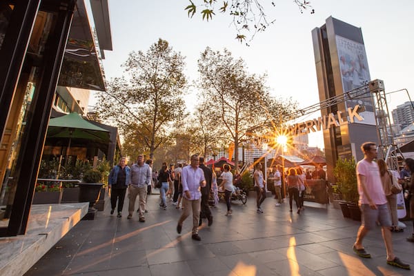 Southbank Promenade showing street scenes, a sunset and signage