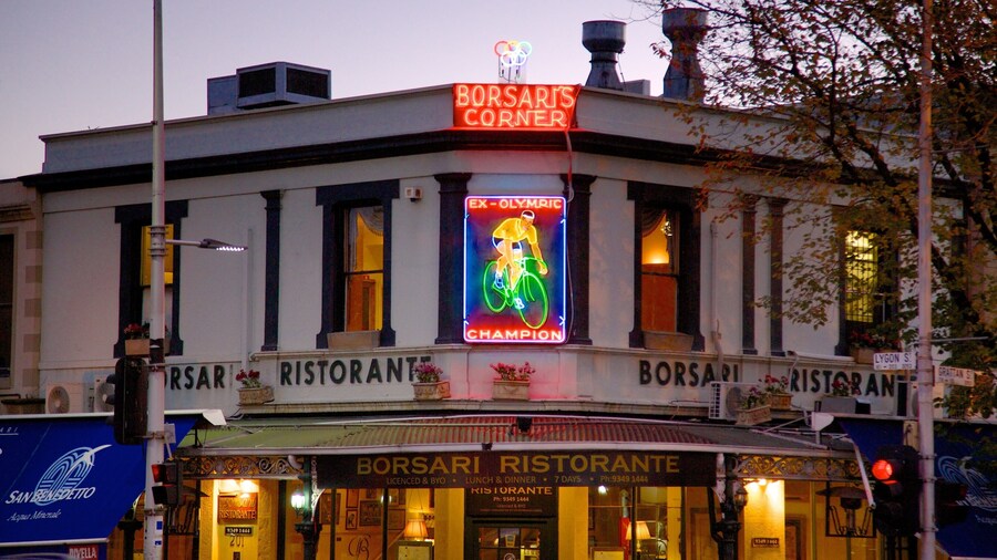 Calle Lygon que incluye restaurantes, señalización y imágenes de calles