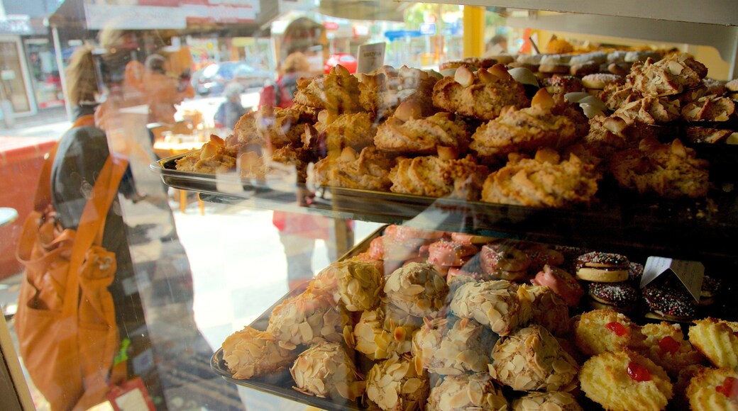 Calle Acland que incluye compras y comida y también una mujer
