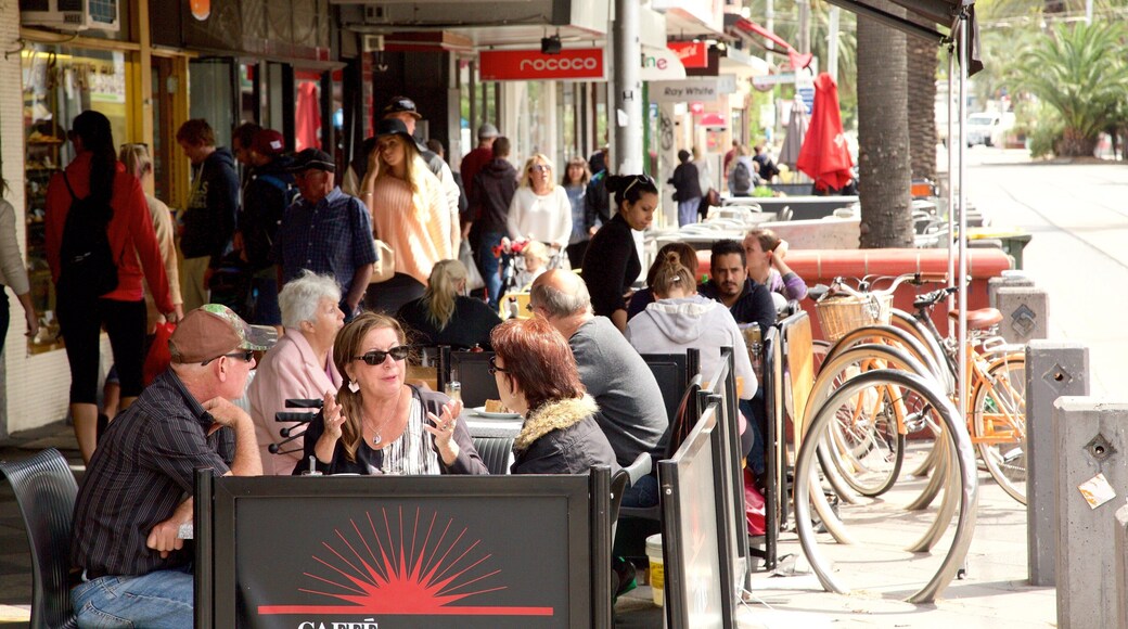 Acland Street featuring café lifestyle and outdoor eating as well as a large group of people
