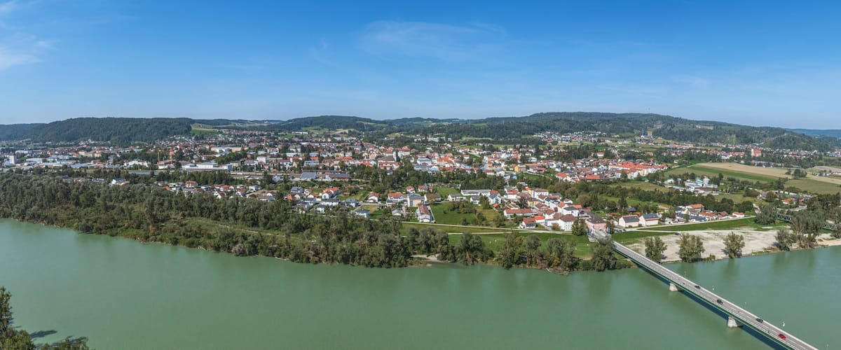 A town by a river with a bridge.