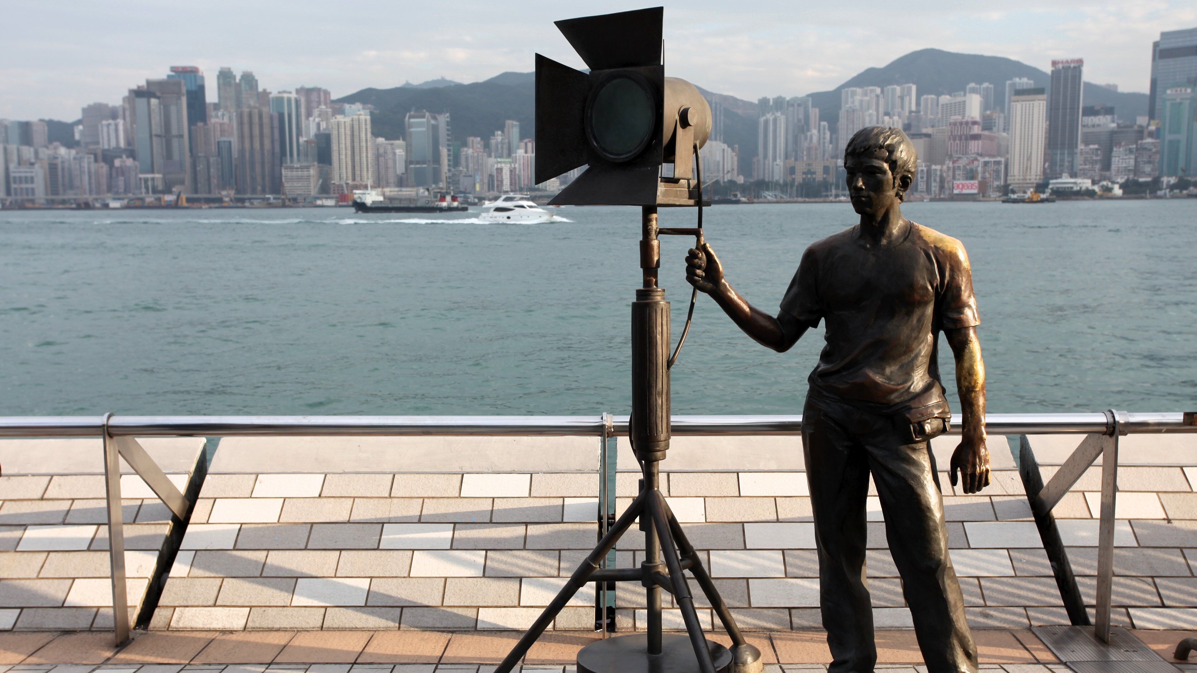 Avenue of Stars som viser monument, statue eller skulptur og bukt eller havn