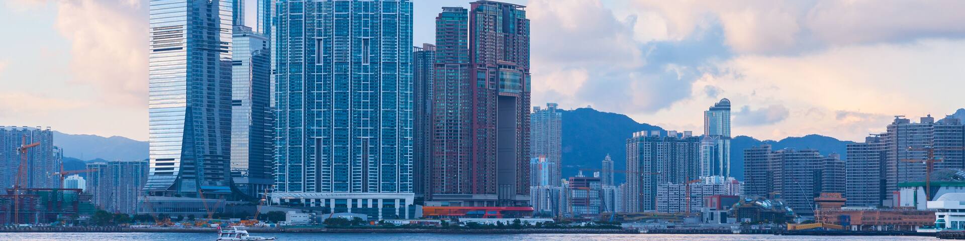 Modern cityscape with skyscrapers. International Commerce Centre of Hong Kong under cloudy evening sky; Shutterstock ID 1064430485; purchase_order: SF 06557000; job: ; client: ; other: