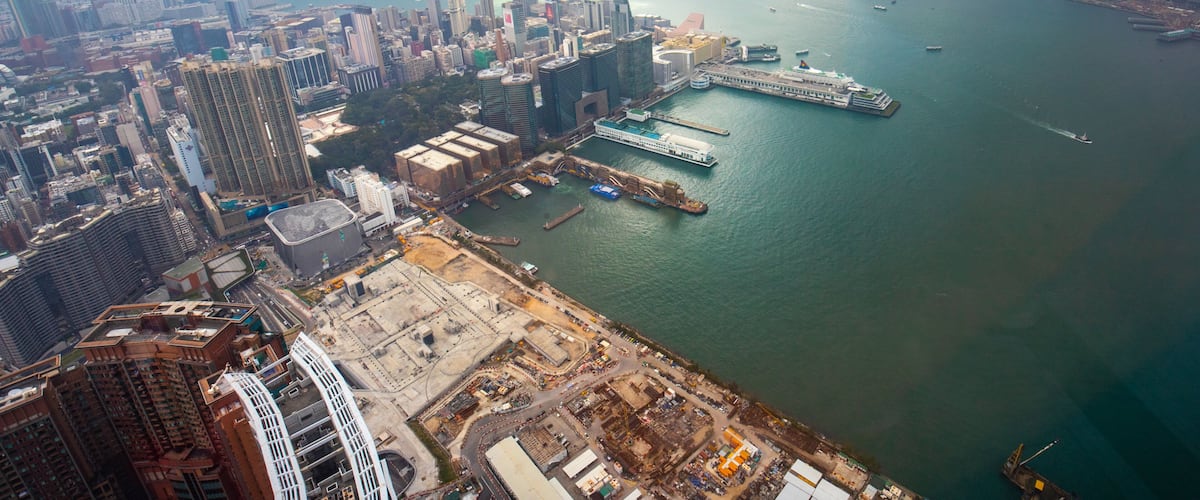 Sky 100 showing mist or fog, a bay or harbor and a city