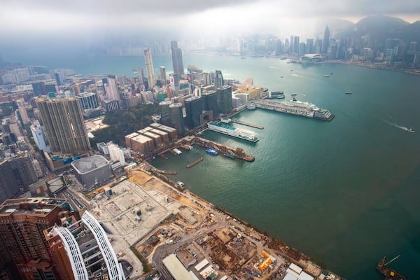 Sky 100 showing mist or fog, a bay or harbor and a city