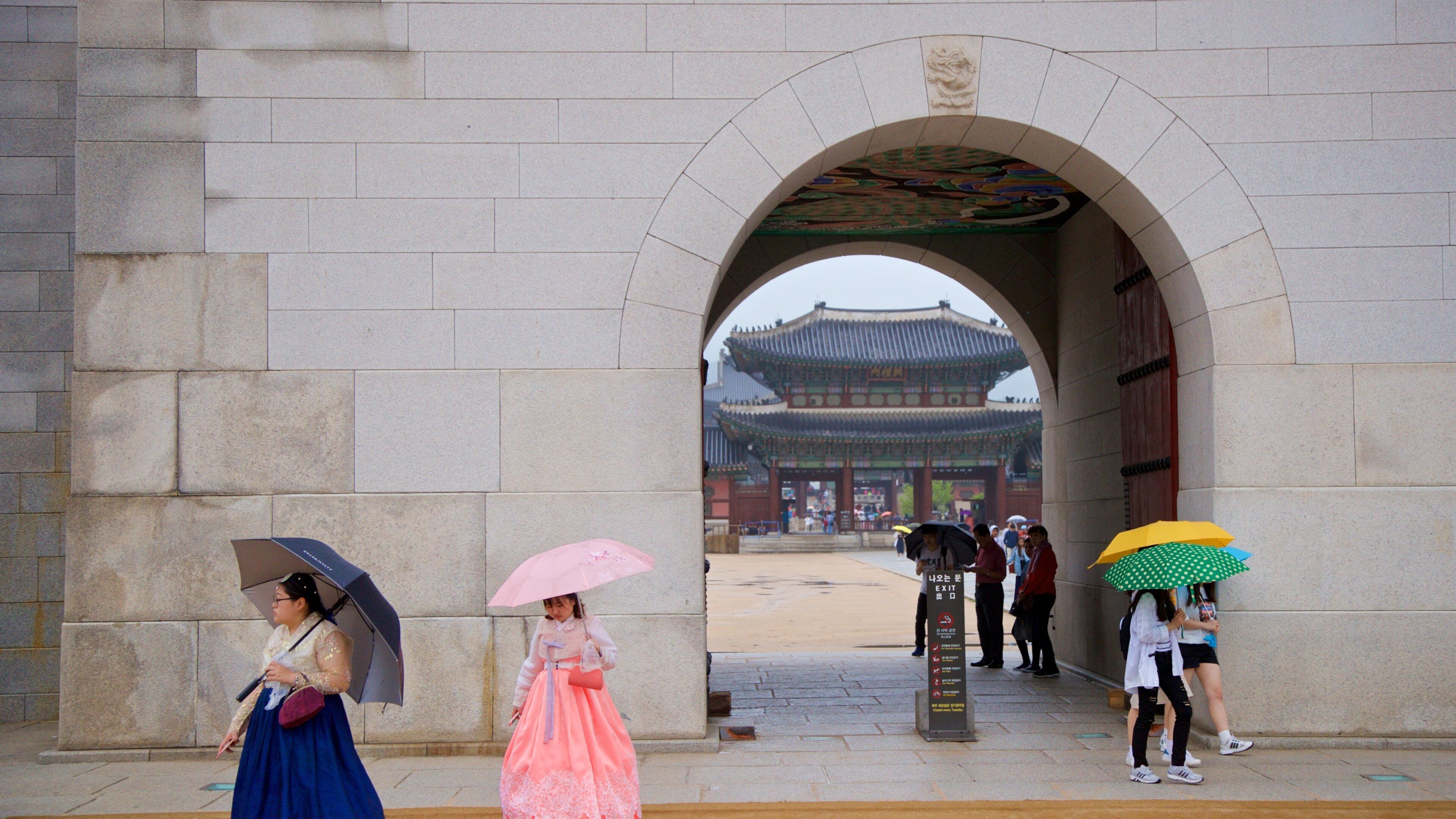 Gwanghwamun featuring street scenes as well as a small group of people