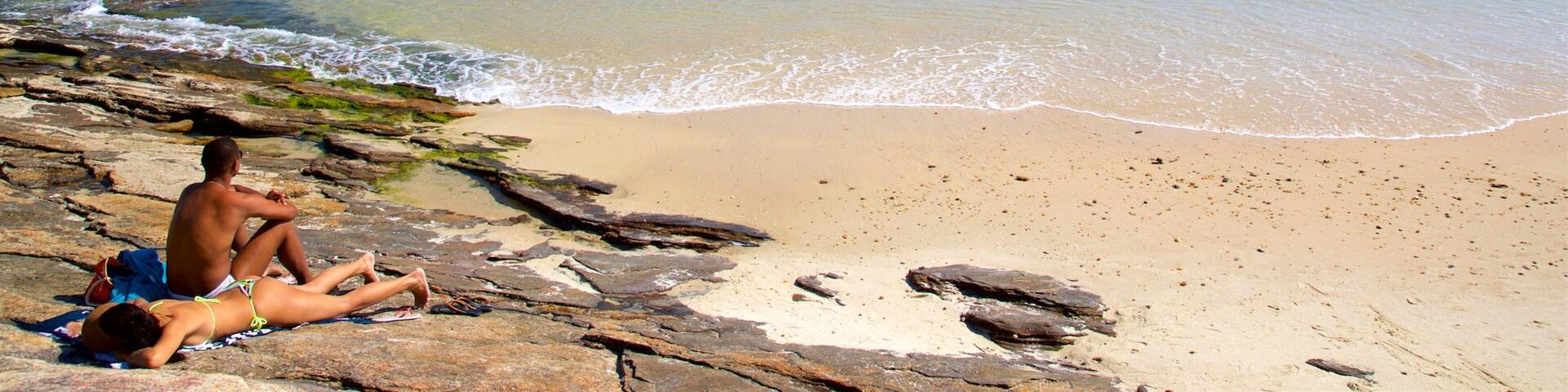 Azeda Beach showing general coastal views and a sandy beach as well as a couple