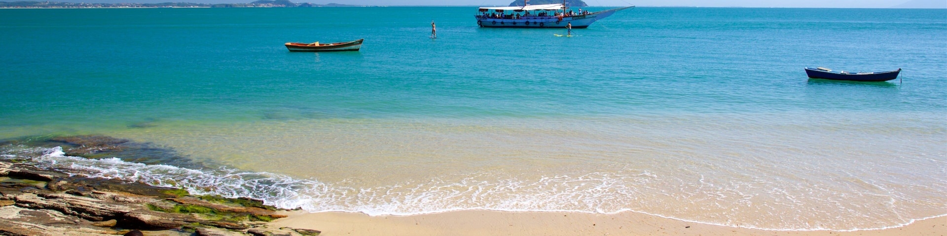 Azeda Beach showing general coastal views and a sandy beach as well as a couple