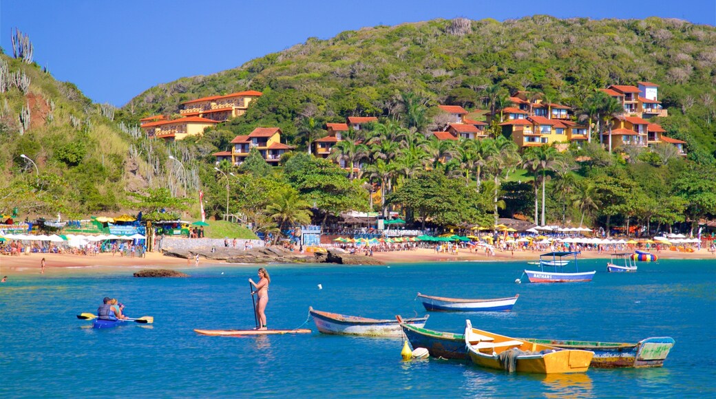 Joao Fernandes Beach which includes a coastal town, kayaking or canoeing and general coastal views
