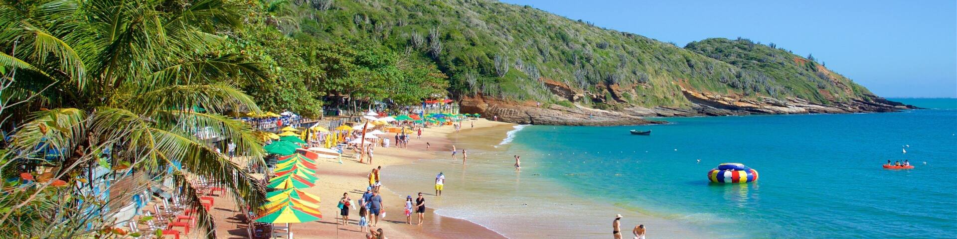 Joao Fernandes Beach which includes a sandy beach and general coastal views as well as a small group of people