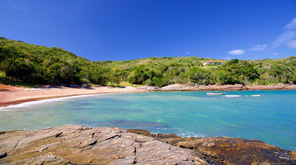 Forno Beach showing a sandy beach, general coastal views and rocky coastline