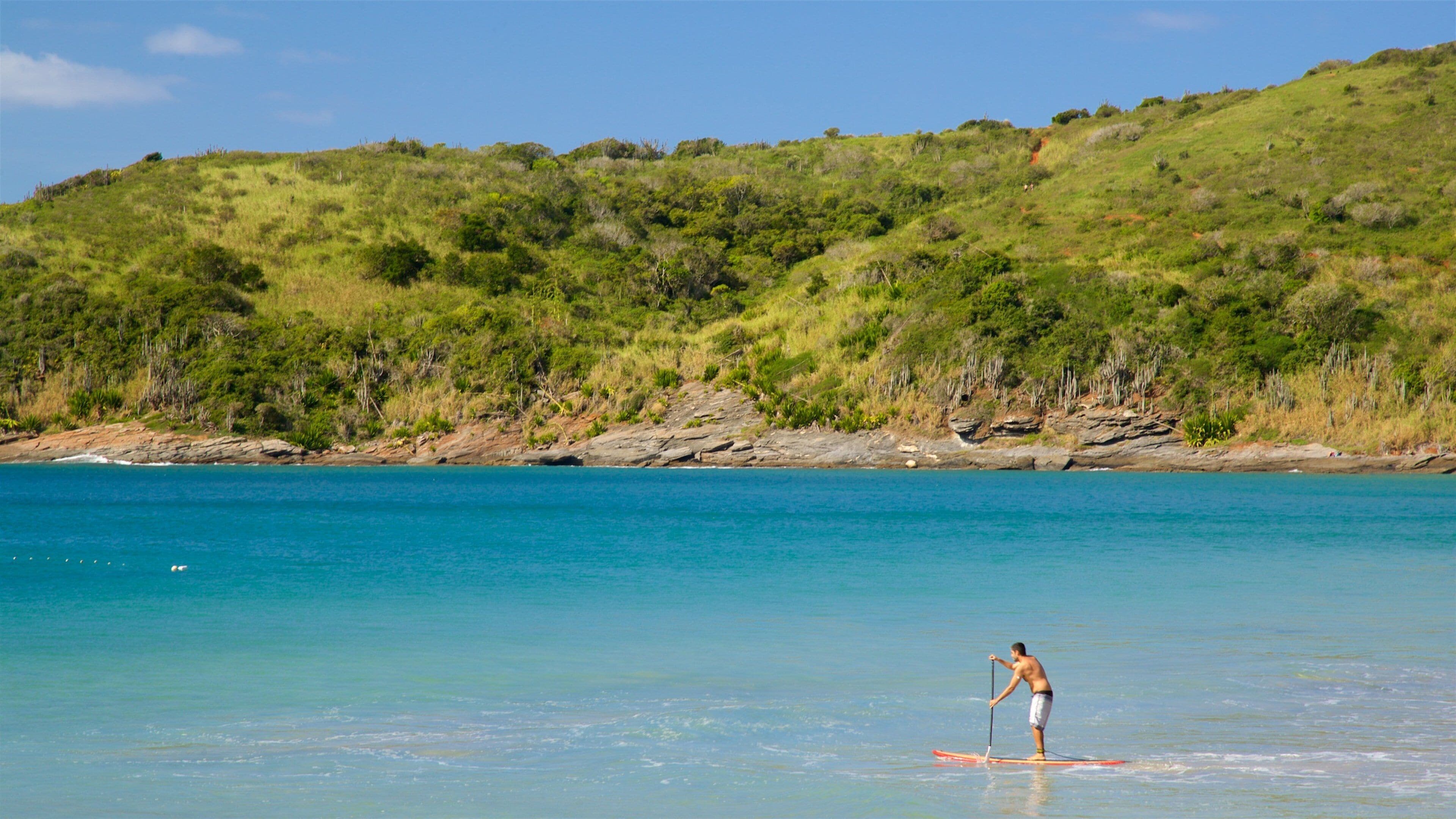 Brava Beach which includes kayaking or canoeing and general coastal views as well as an individual male