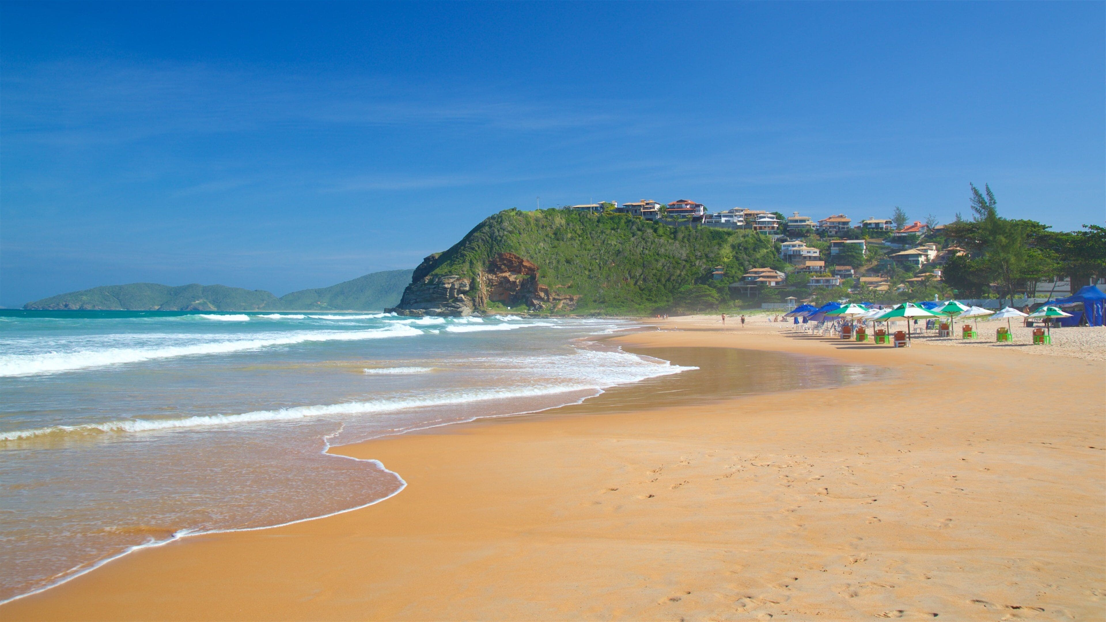 Geriba Beach showing a sandy beach, general coastal views and a coastal town