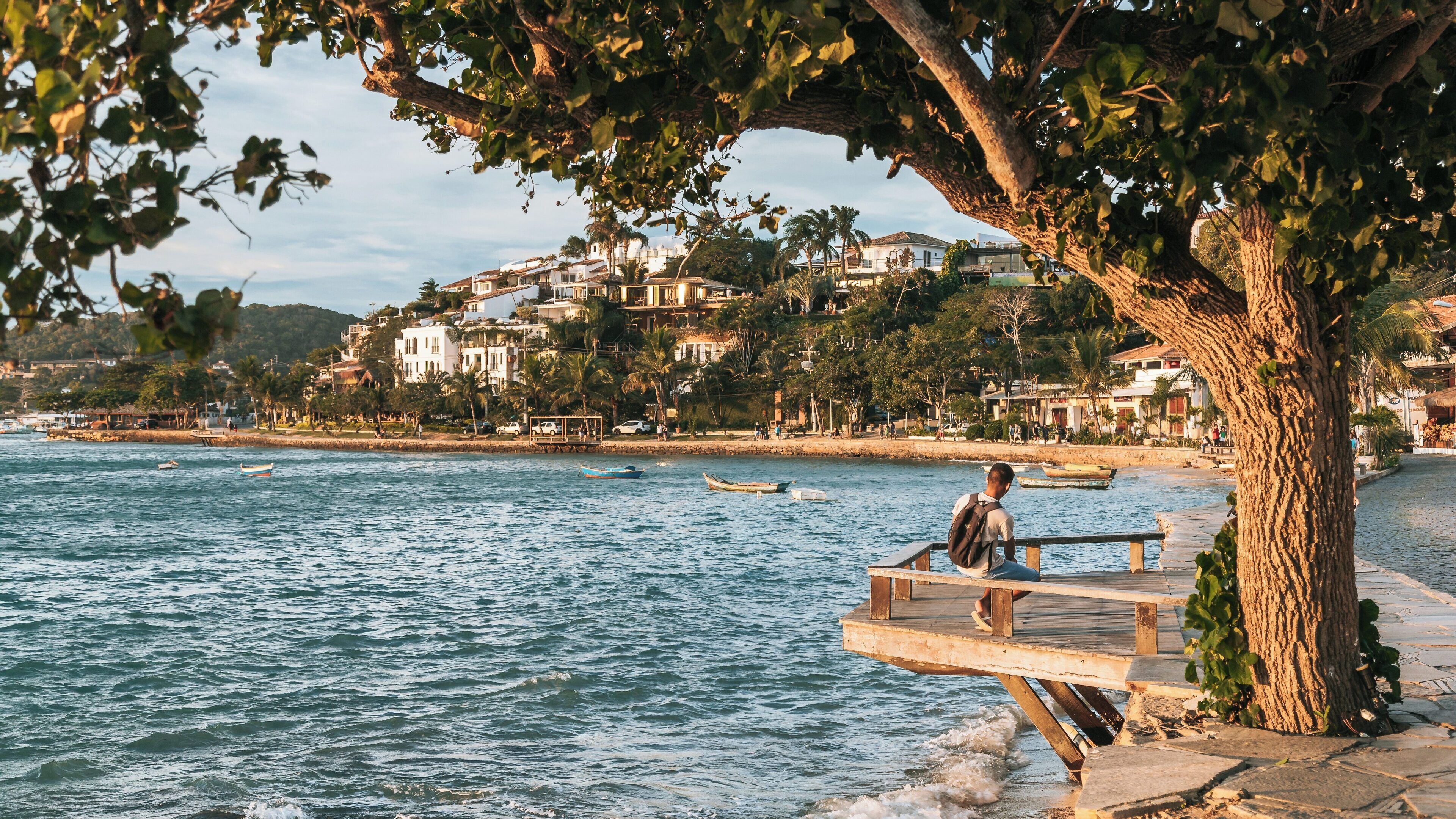 Enjoying the tranquil views at Orla Bardot waterfront in Humaita, Buzios, Rio de Janeiro during a peaceful evening