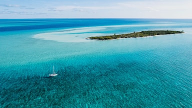 Aerial of Sailboat Next to Island in Turquoise Bahamas Water