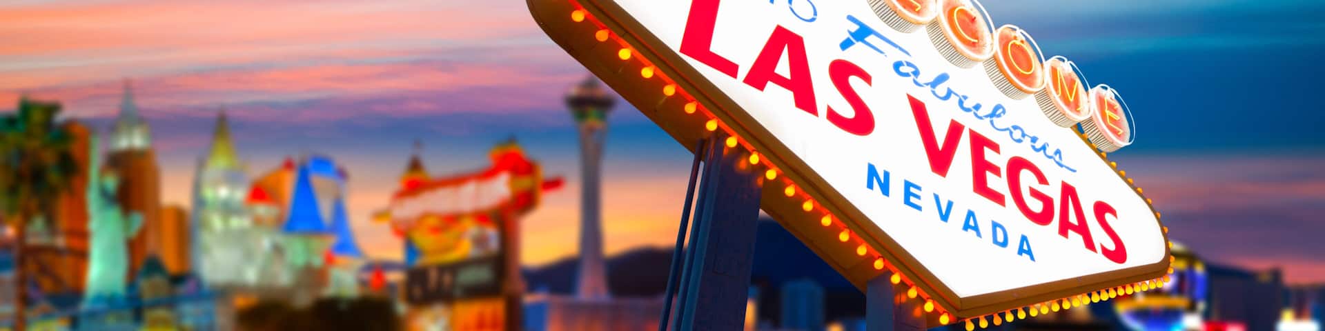 Welcome To Fabulous Las Vegas Sign With Beautiful City Lights at Sunset